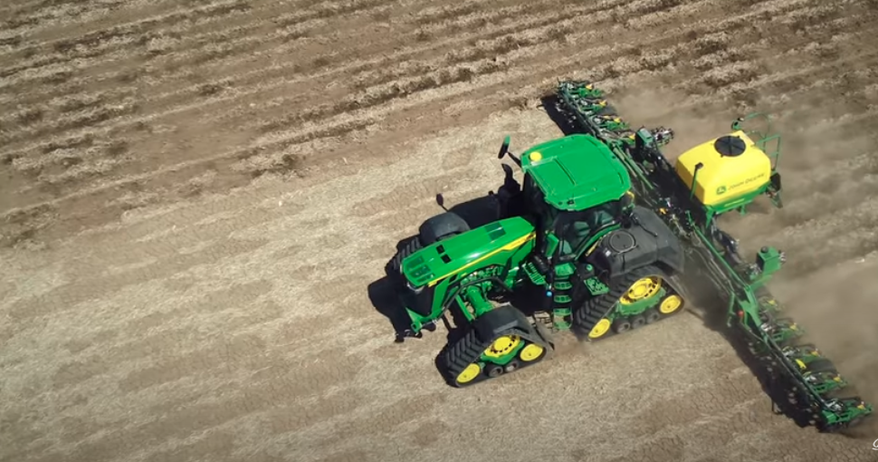 An overhead shot of a John Deere machine assisting in planting.